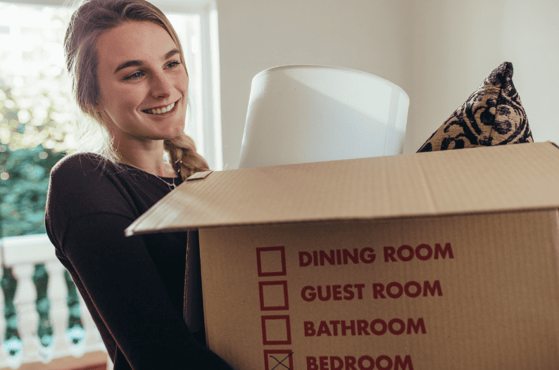 Woman with brown moving box